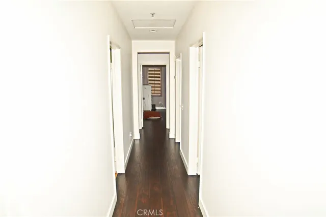 a view of a hallway with a white walls