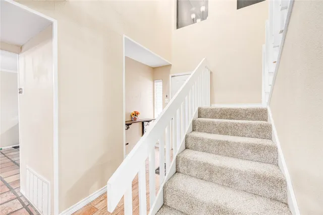 a view of staircase with white walls