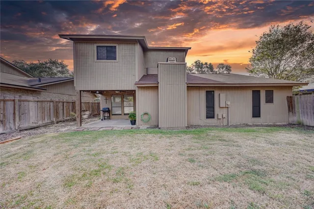 a house view with a backyard space