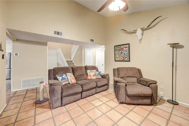 a living room with furniture and a rug