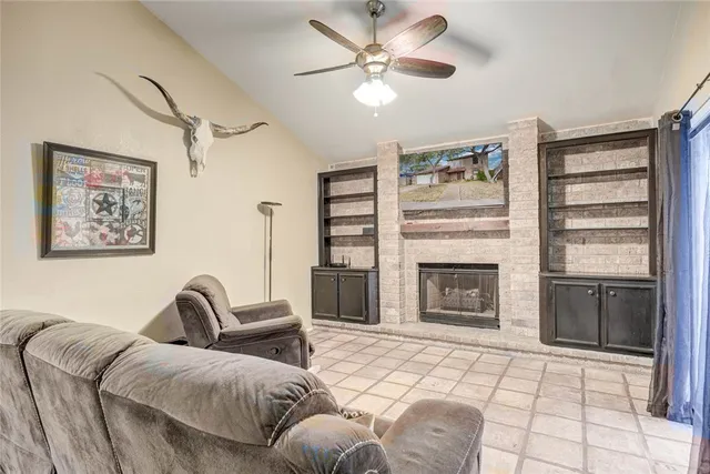 a spacious bedroom with a bed and a fireplace