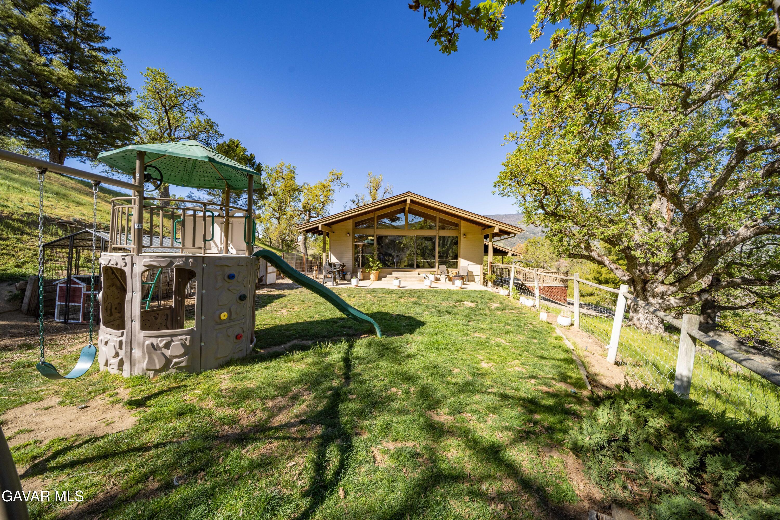 23580 Timberline Way Tehachapi, CA 93561 - Photo 44 of 50 an outdoor view of house with swimming pool and sitting area
