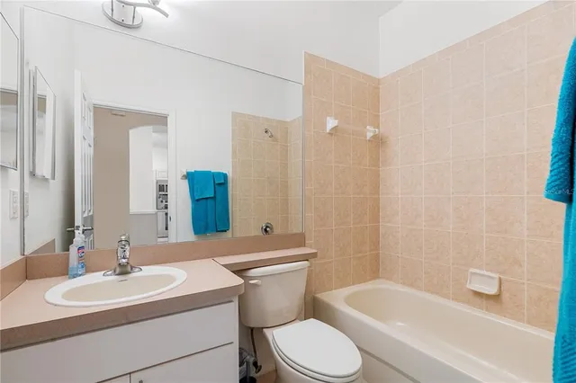 a bedroom with a bed and a tv