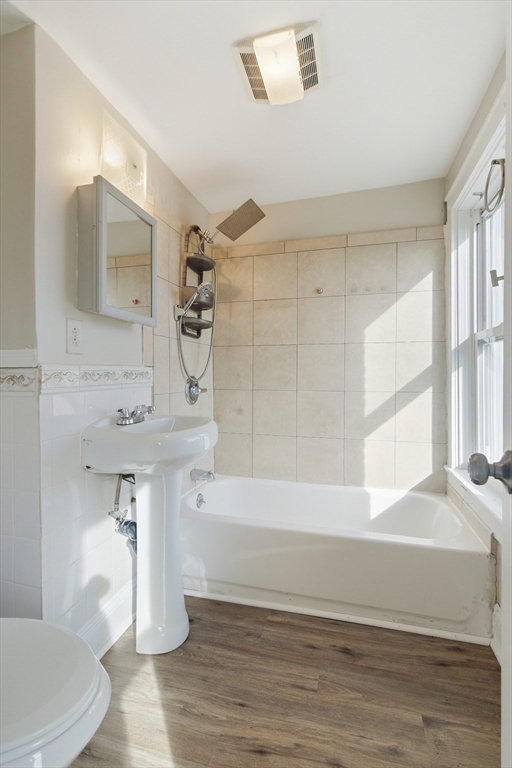 293 Clemente Street, Unit 3R Holyoke, MA 01040 - Photo 9 of 14 a bathroom with a sink a toilet and bathtub