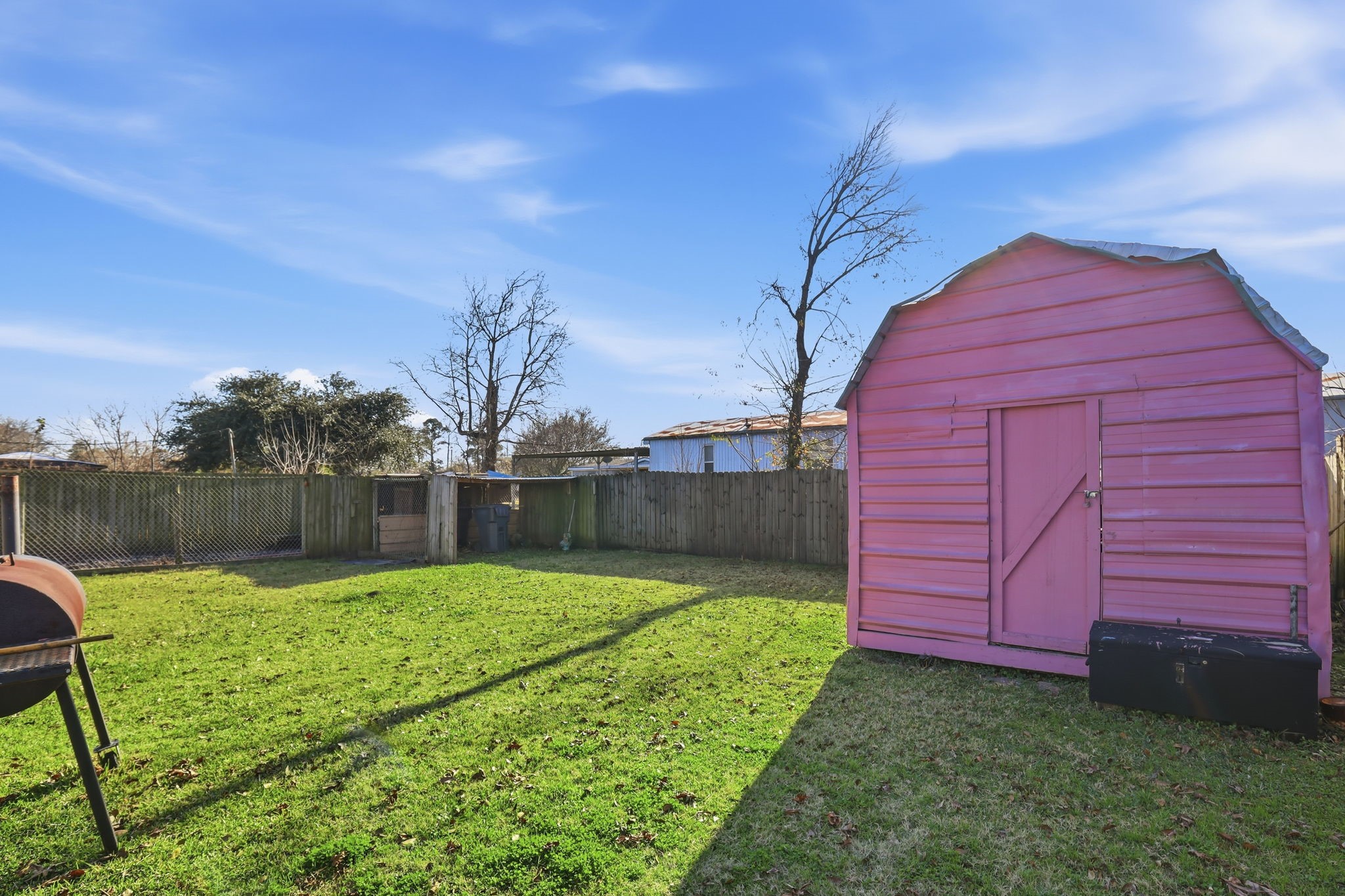 829 Becker Street Channelview, TX 77530 - Photo 13 of 19 a view of a backyard with a small cabin