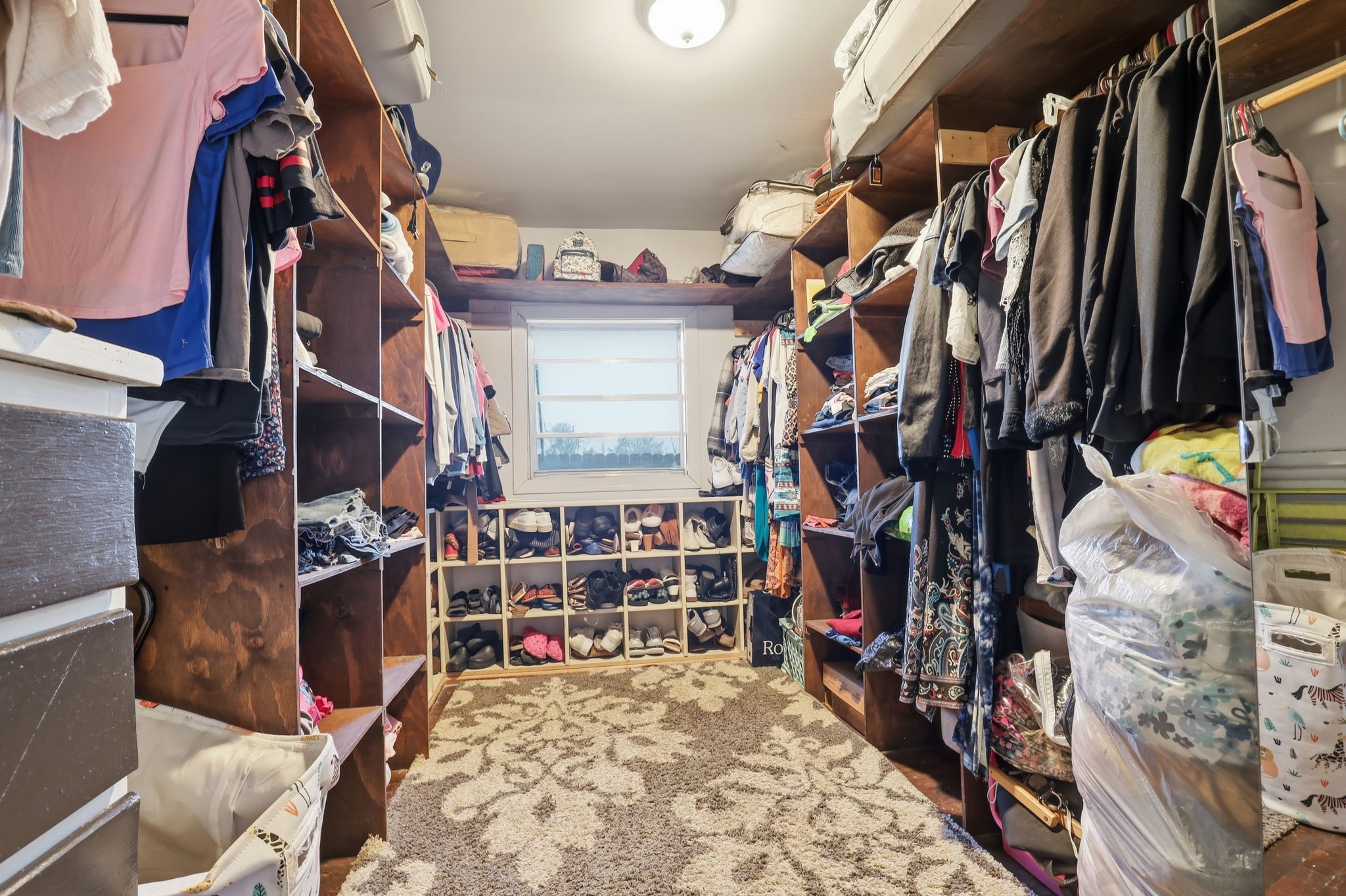 829 Becker Street Channelview, TX 77530 - Photo 9 of 19 a view of walk in closet with clothes and shoes