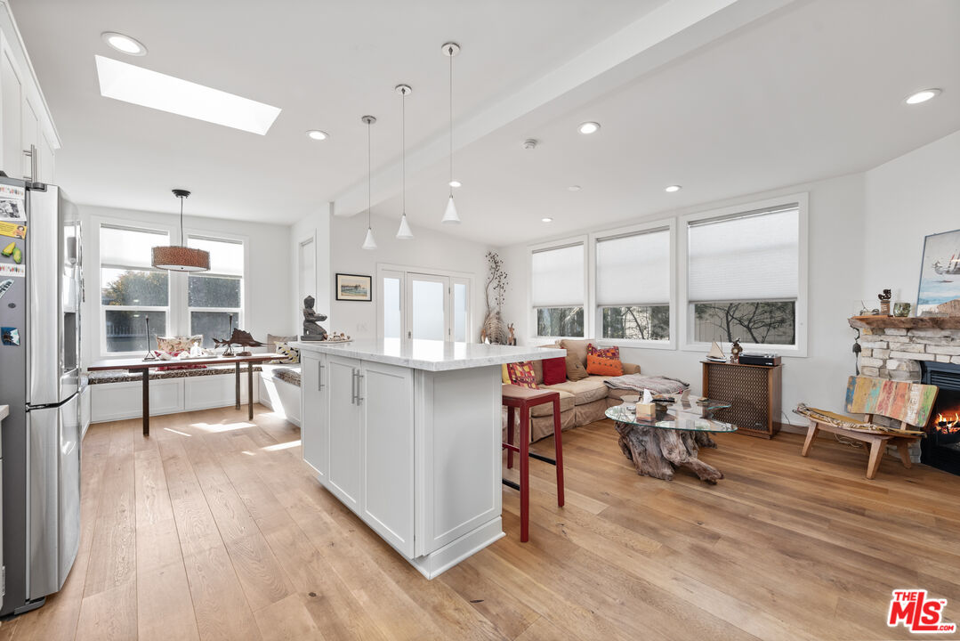 29500 Heathercliff Road, Unit 16 Malibu, CA 90265 - Photo 15 of 25 a living room with furniture and a table
