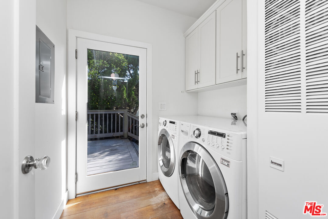 29500 Heathercliff Road, Unit 16 Malibu, CA 90265 - Photo 17 of 25 a view of a hallway with washer and dryer