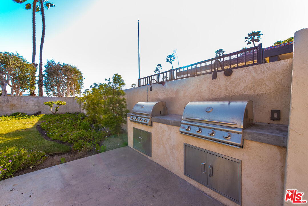 29500 Heathercliff Road, Unit 16 Malibu, CA 90265 - Photo 22 of 25 a terrace view with sitting space and garden view