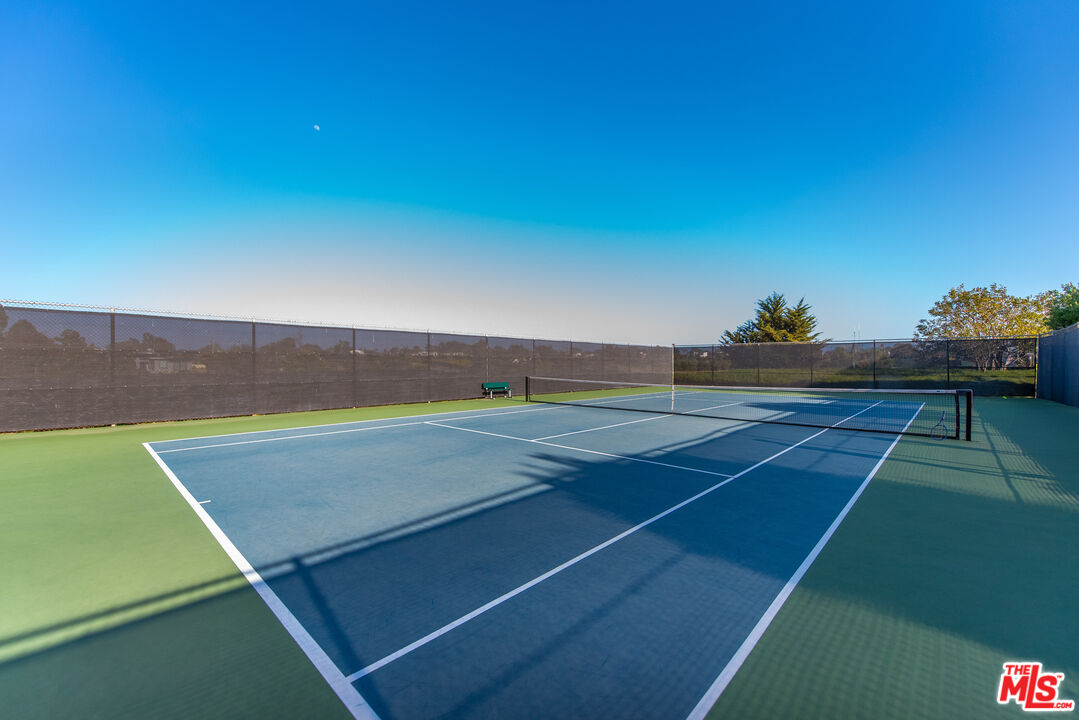 29500 Heathercliff Road, Unit 16 Malibu, CA 90265 - Photo 23 of 25 a view of an outdoor space and tennis court