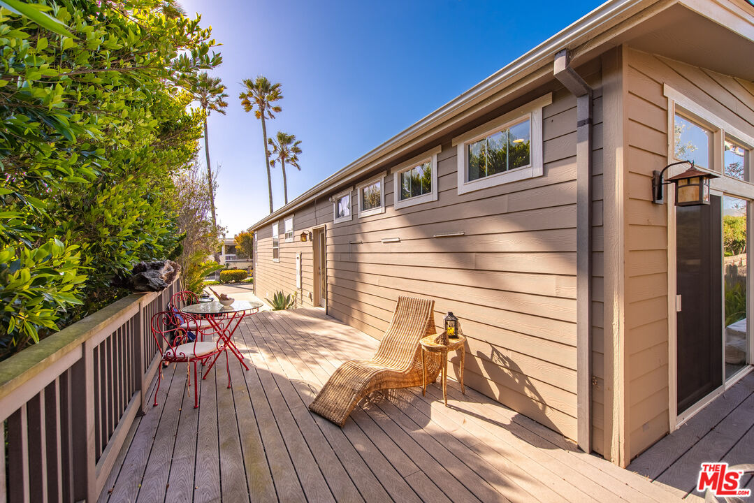 29500 Heathercliff Road, Unit 16 Malibu, CA 90265 - Photo 4 of 25 a view of a house with backyard and sitting area