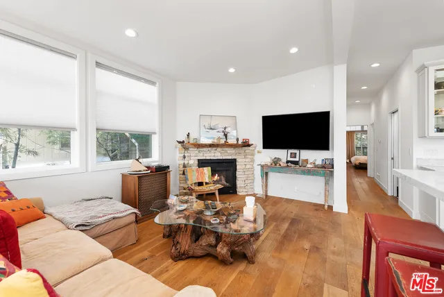 a living room with furniture fireplace and a flat screen tv