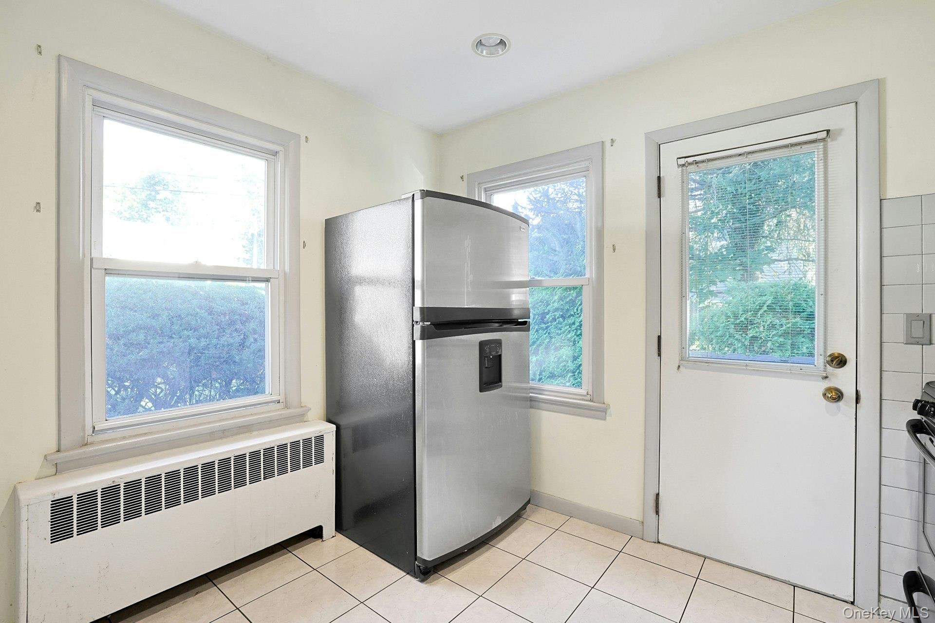 86 Braunsdorf Road Pearl River, NY 10965 - Photo 11 of 38 a kitchen with windows and refrigerator