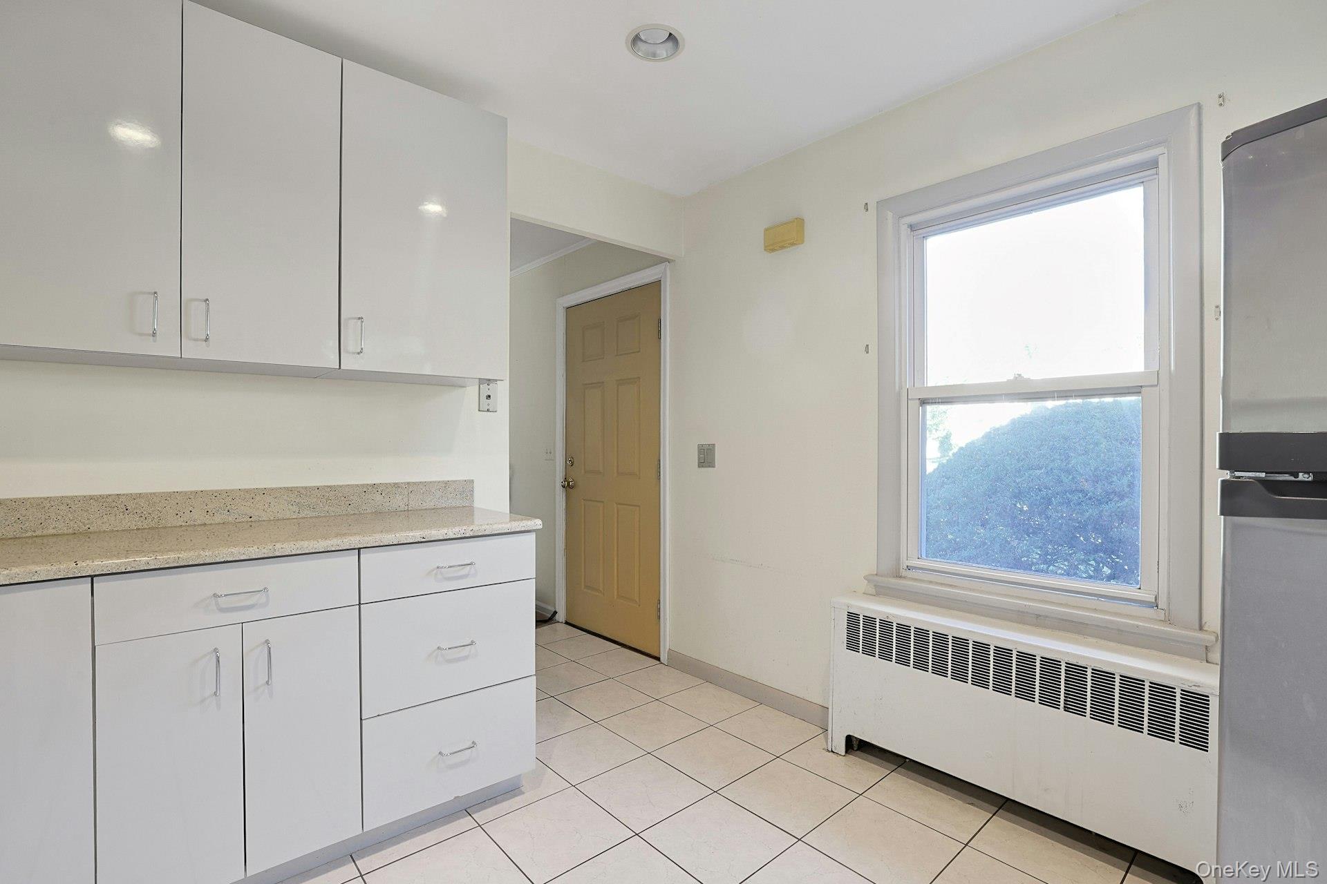 86 Braunsdorf Road Pearl River, NY 10965 - Photo 13 of 38 a view of a kitchen with white cabinets