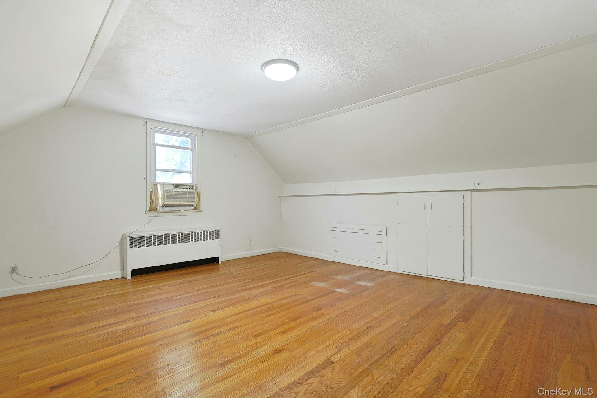 86 Braunsdorf Road Pearl River, NY 10965 - Photo 22 of 38 a view of a room with wooden floor and white walls