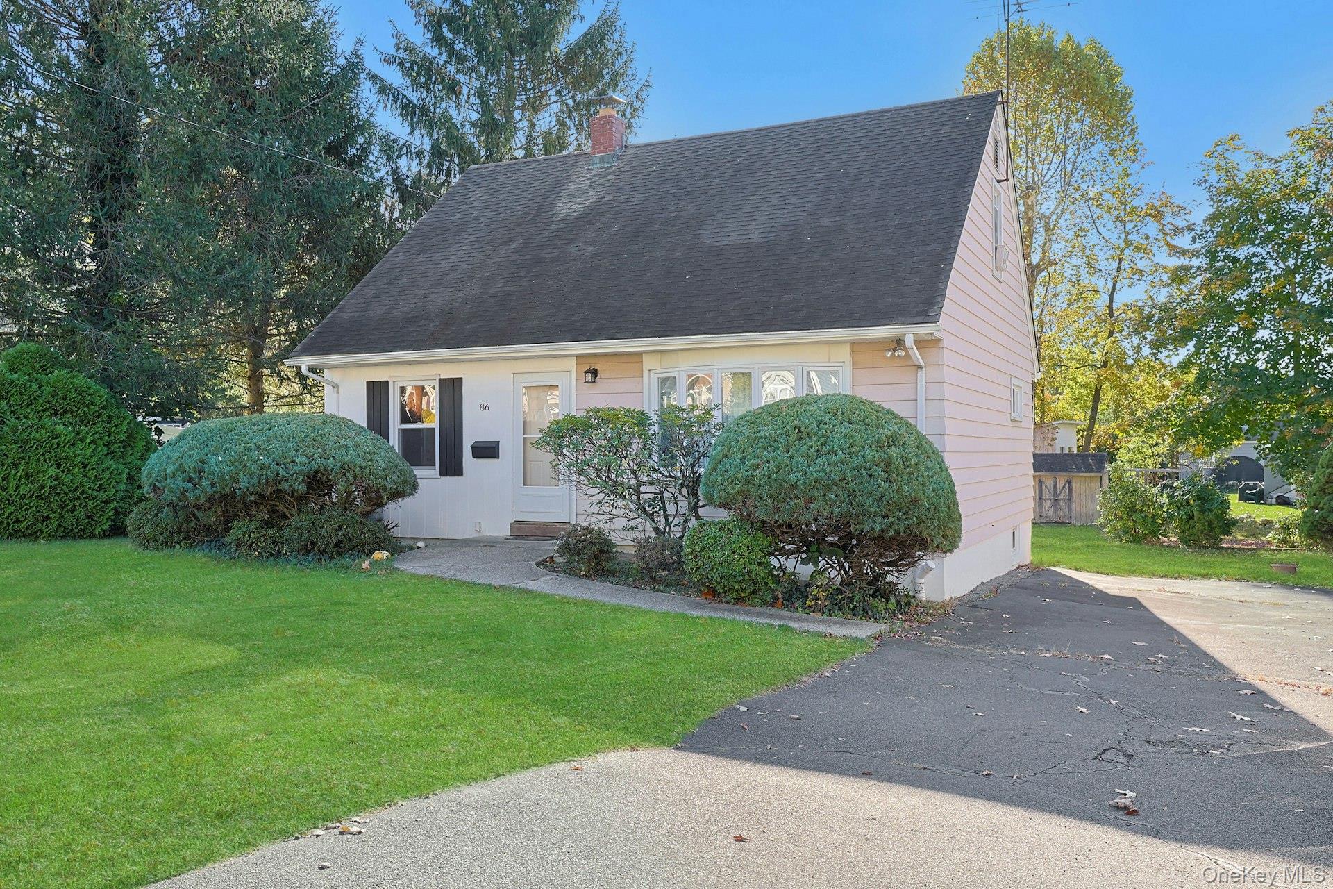 86 Braunsdorf Road Pearl River, NY 10965 - Photo 3 of 38 a view of a house with a yard and plants