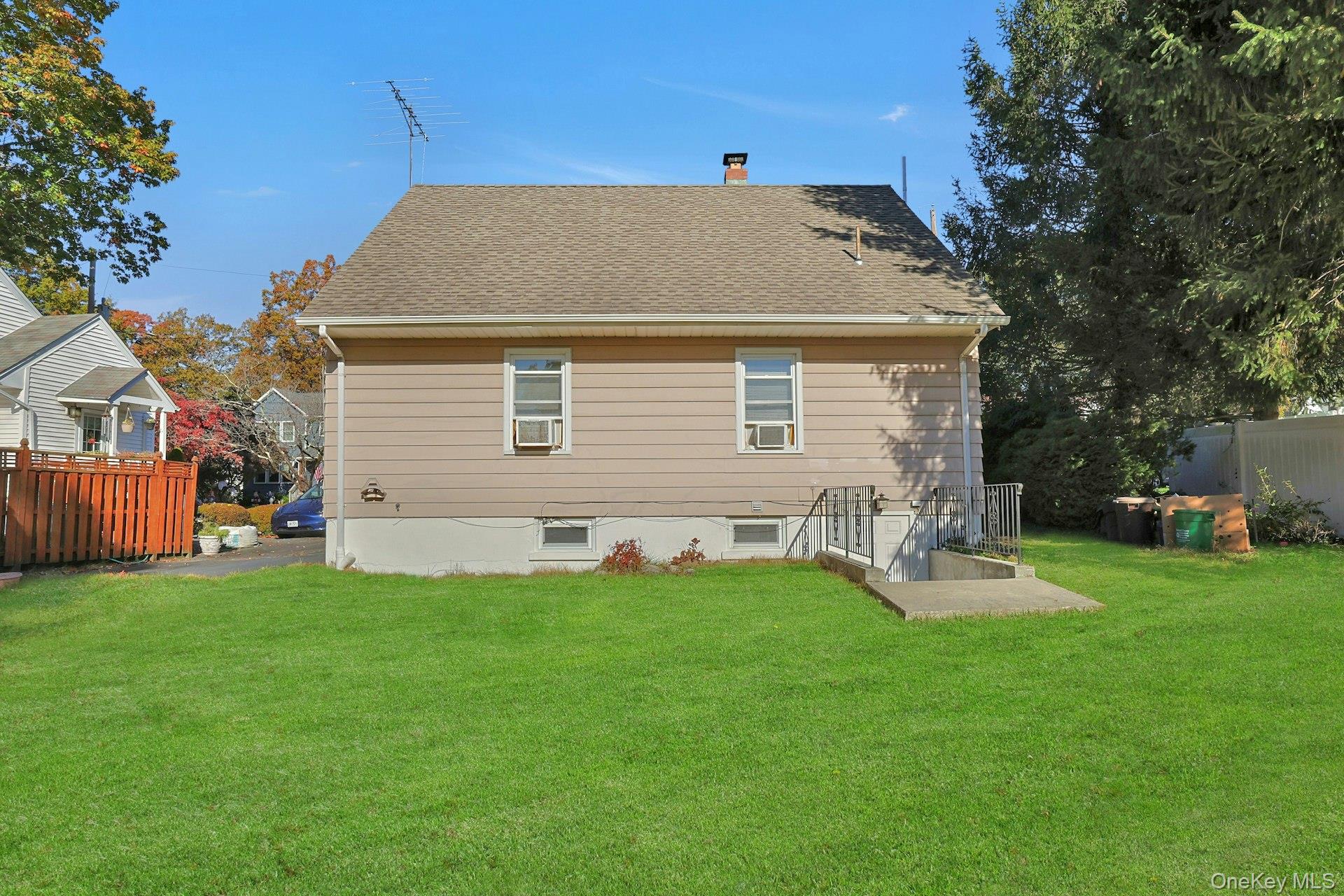 86 Braunsdorf Road Pearl River, NY 10965 - Photo 34 of 38 a front view of house with yard and trees