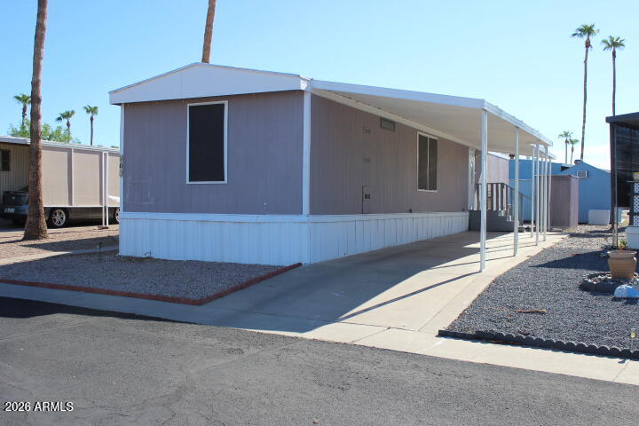 9501 East Broadway Road, Unit 101 Mesa, AZ 85208 - Photo 1 of 24 a view of a house with a street