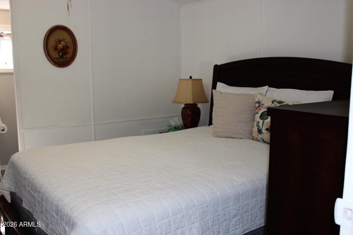 9501 East Broadway Road, Unit 101 Mesa, AZ 85208 - Photo 12 of 24 a bedroom with a bed and a window