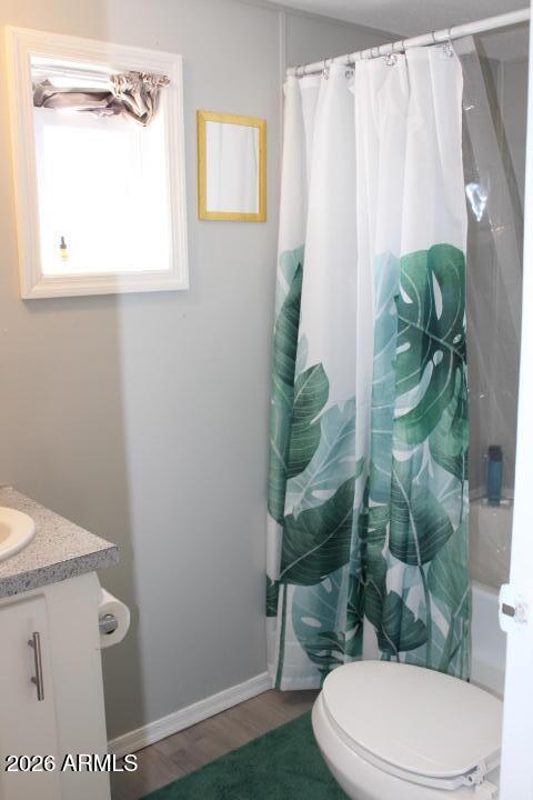 9501 East Broadway Road, Unit 101 Mesa, AZ 85208 - Photo 14 of 24 a white toilet sitting next to a shower curtain