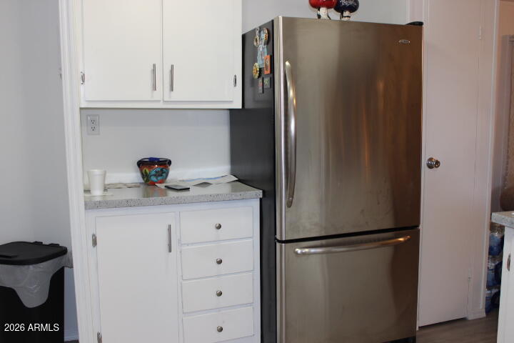 9501 East Broadway Road, Unit 101 Mesa, AZ 85208 - Photo 15 of 24 a kitchen with stainless steel appliances a refrigerator and cabinets