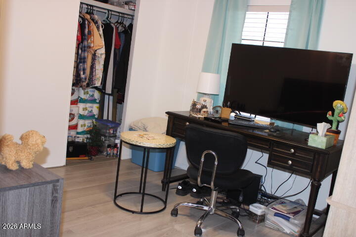9501 East Broadway Road, Unit 101 Mesa, AZ 85208 - Photo 16 of 24 a living room with furniture and a flat screen tv