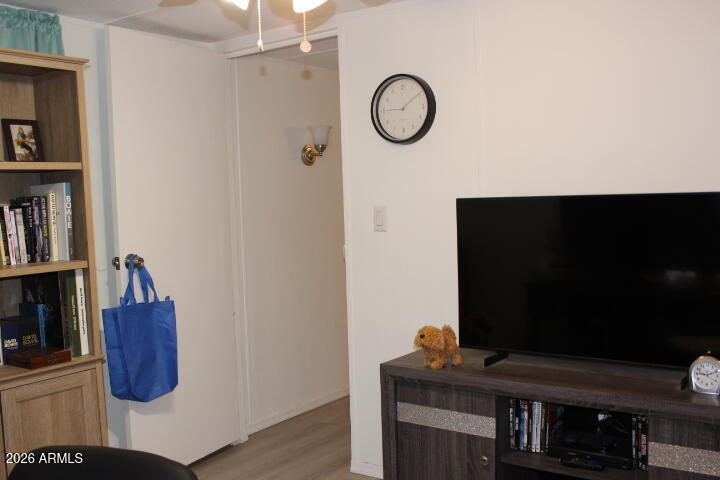 9501 East Broadway Road, Unit 101 Mesa, AZ 85208 - Photo 17 of 24 a living room with furniture and a flat screen tv