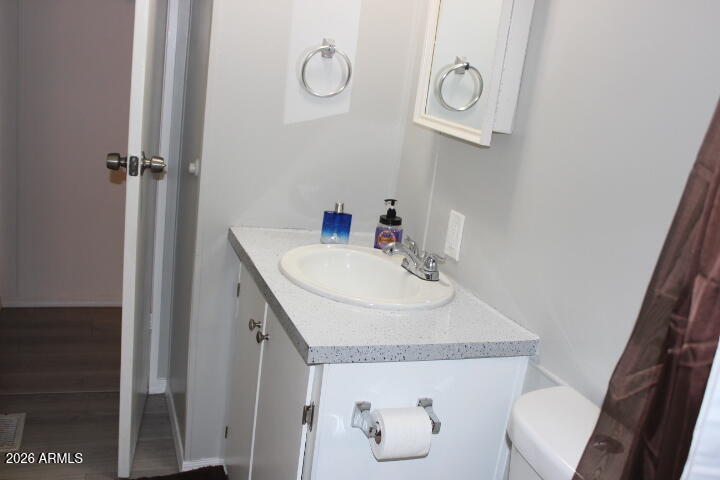 9501 East Broadway Road, Unit 101 Mesa, AZ 85208 - Photo 19 of 24 a bathroom with a sink and a mirror