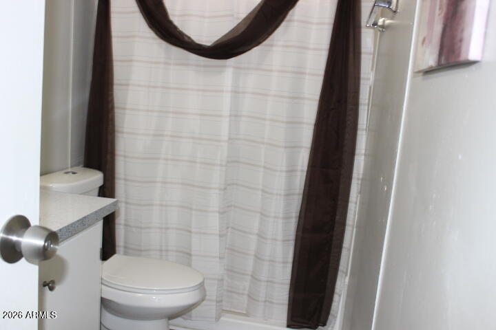 9501 East Broadway Road, Unit 101 Mesa, AZ 85208 - Photo 20 of 24 a bathroom with a toilet and a shower