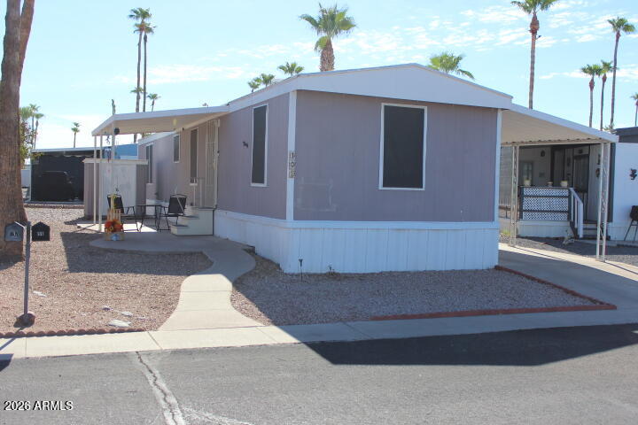 9501 East Broadway Road, Unit 101 Mesa, AZ 85208 - Photo 24 of 24 a front view of a house with entertaining space