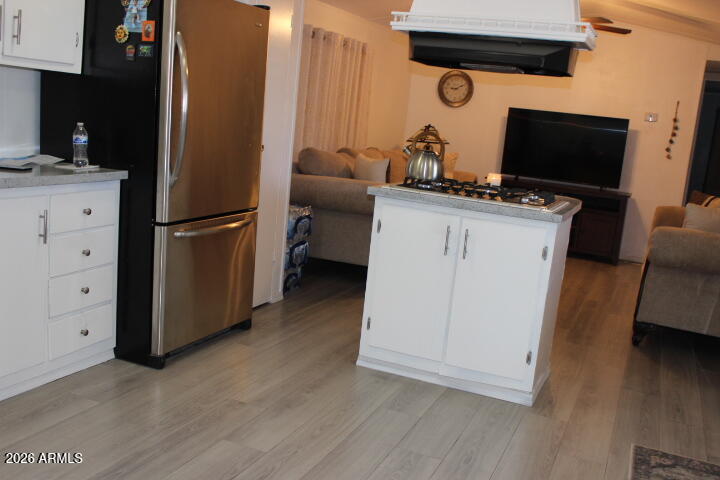 9501 East Broadway Road, Unit 101 Mesa, AZ 85208 - Photo 8 of 24 a room with furniture and wooden floor