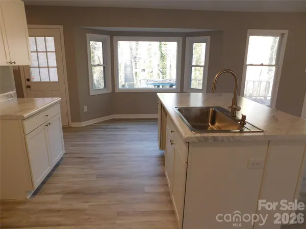 a kitchen with sink and window