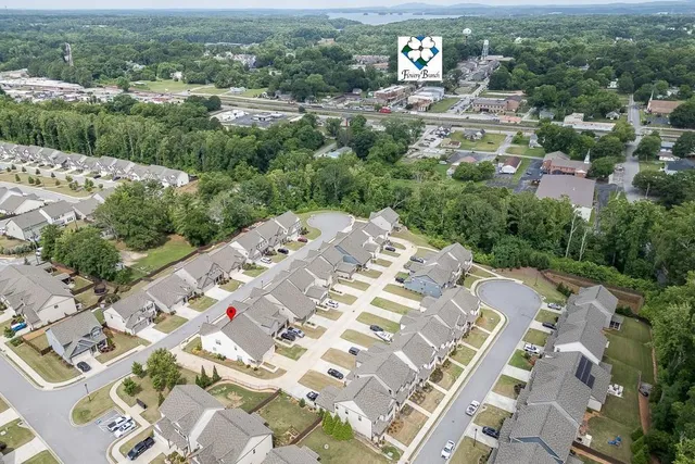 an aerial view of a house with yard swimming pool and mountain view