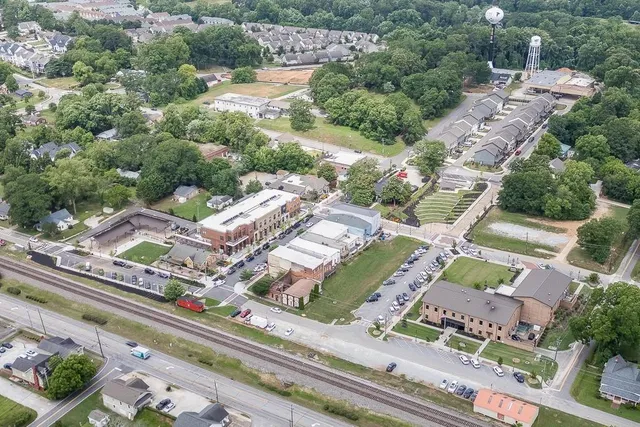 an aerial view of residential houses with outdoor space
