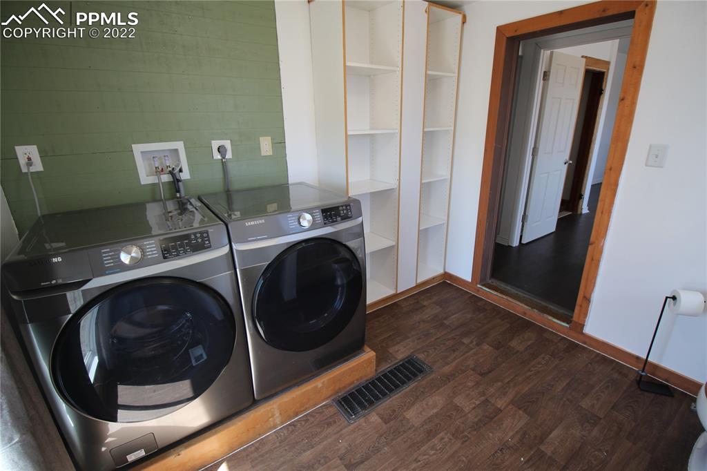 1526 Noe Road Larkspur, CO 80118 - Photo 21 of 29 a utility room with dryer and washer