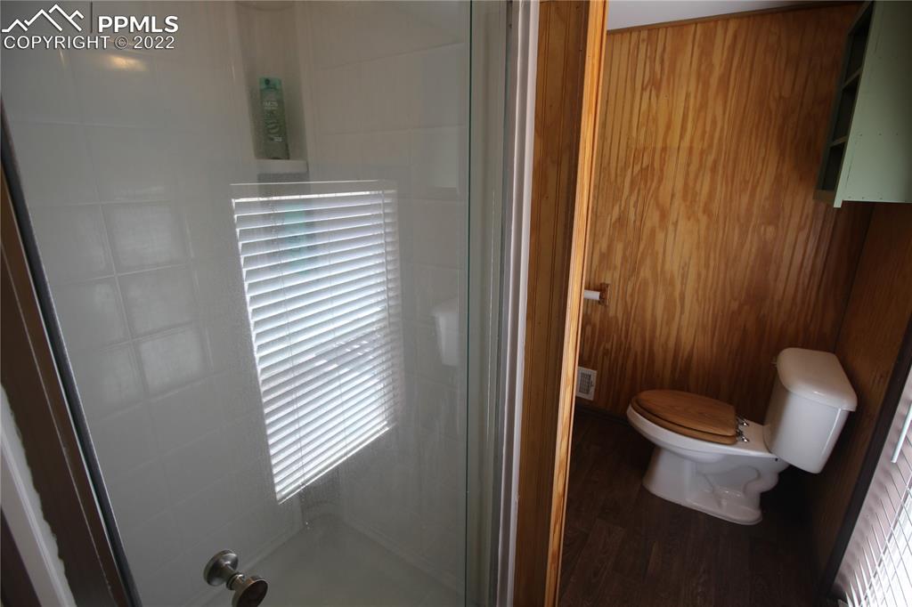 1526 Noe Road Larkspur, CO 80118 - Photo 24 of 29 a white toilet sitting next to a bathroom sink