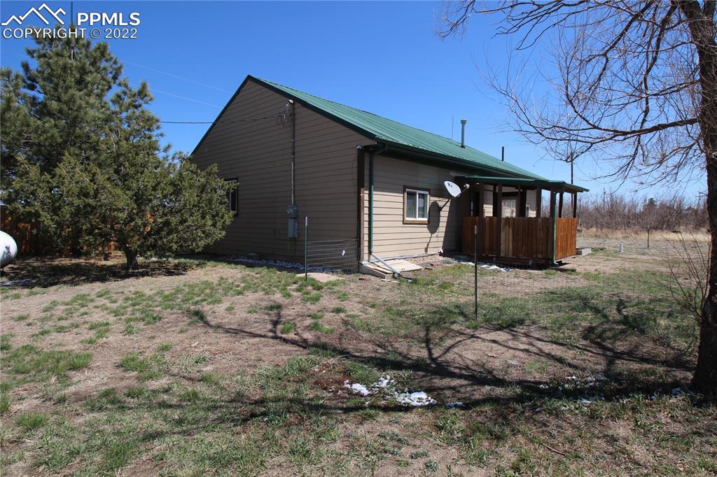 1526 Noe Road Larkspur, CO 80118 - Photo 7 of 29 a view of house with backyard