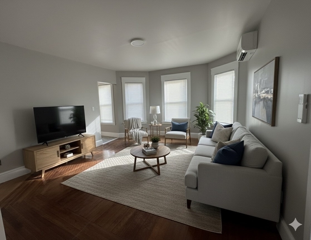 37 Cortland Street, Unit 1 Springfield, MA 01109 - Photo 8 of 14 a living room with furniture and a flat screen tv