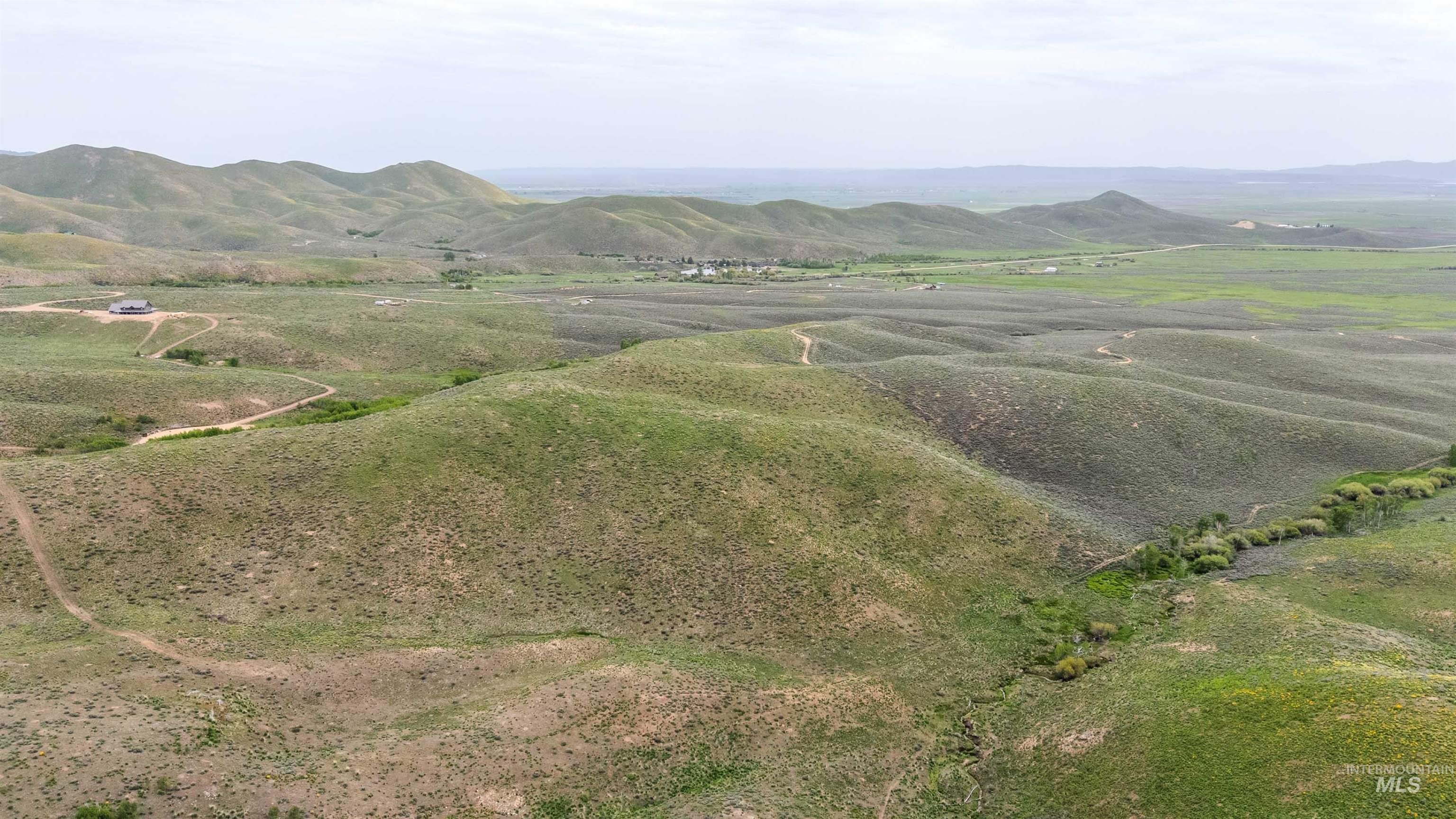 Tbd Homestead Road Fairfield, ID 83327 - Photo 10 of 15 Aerial view of sparsely populated area with a mountainous background