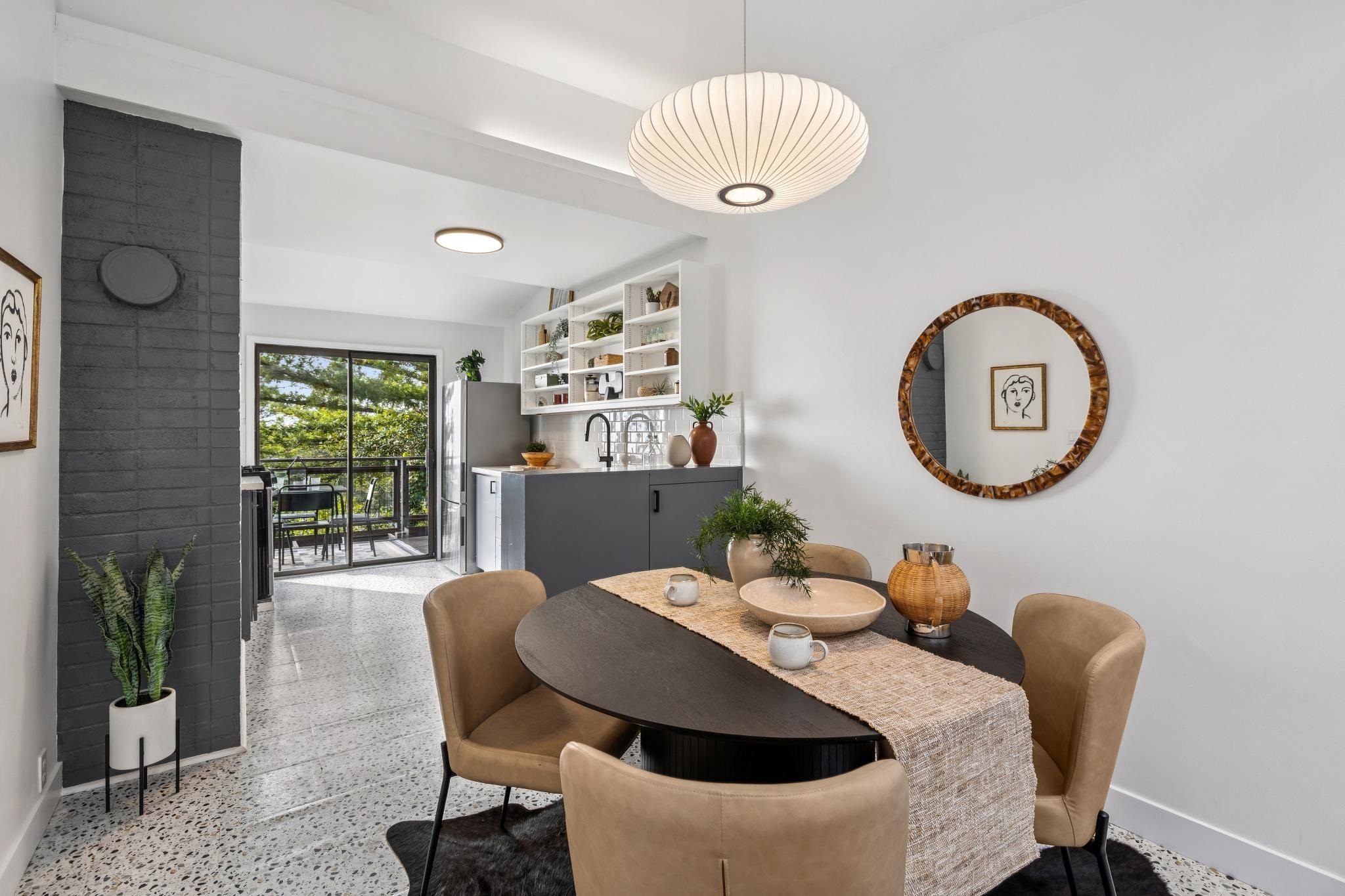 1024 Miller Avenue Berkeley, CA 94708 - Photo 16 of 60 Dining space with dark aggregate flooring and baseboards
