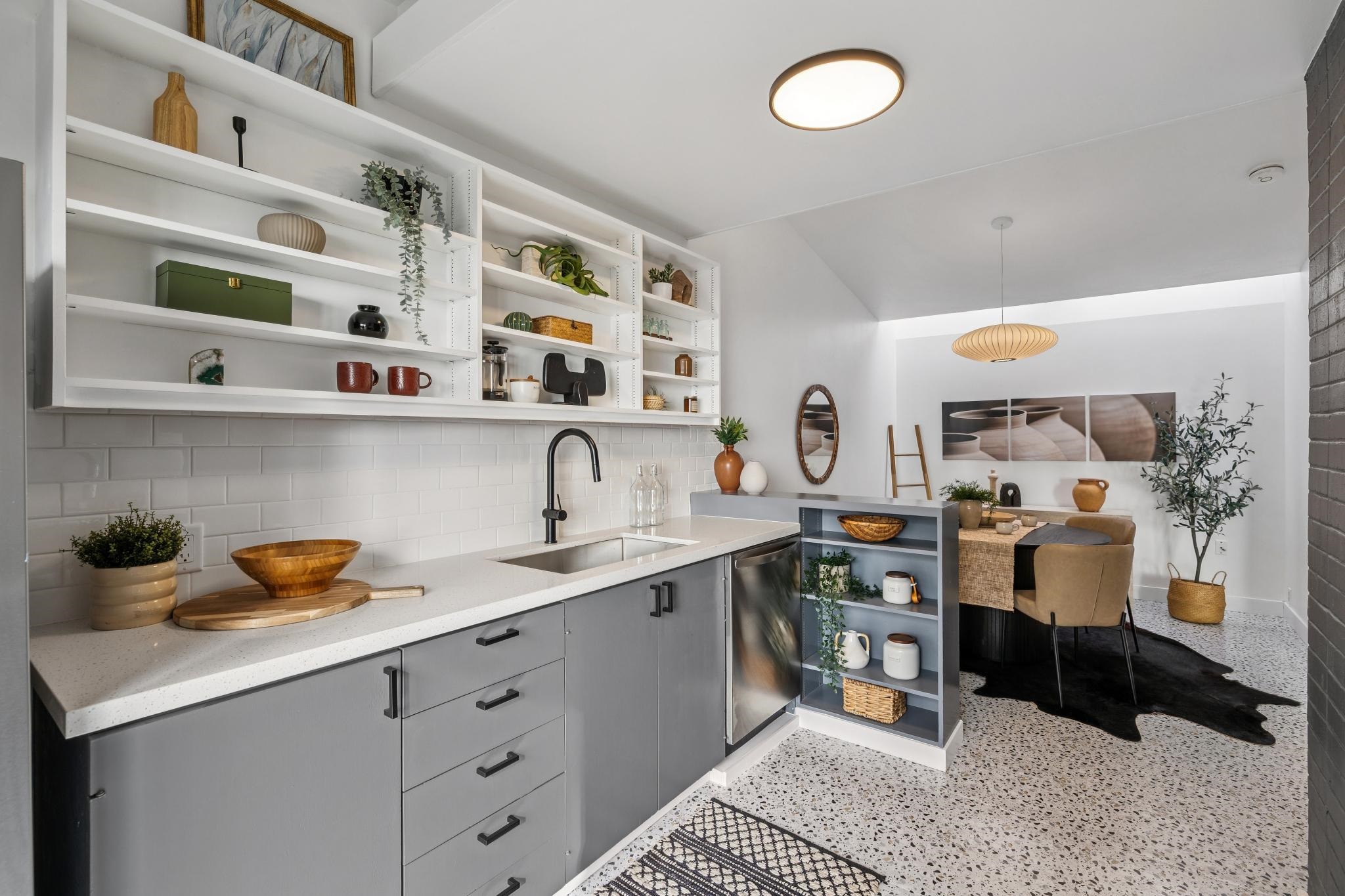 1024 Miller Avenue Berkeley, CA 94708 - Photo 21 of 60 Kitchen with gray cabinetry, backsplash, dark aggregate flooring, dishwasher, and pendant lighting