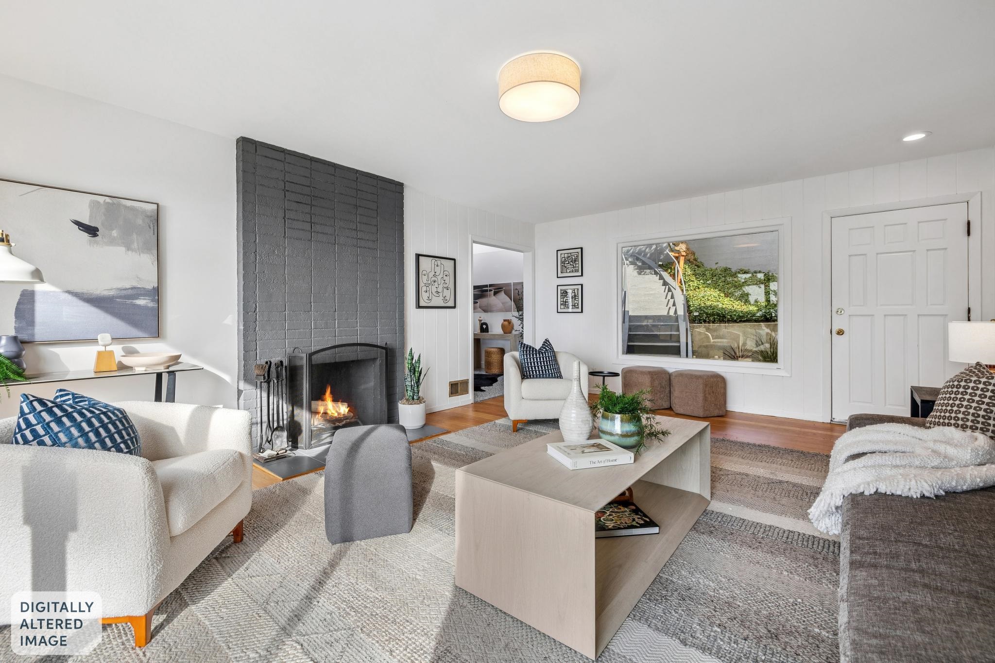 1024 Miller Avenue Berkeley, CA 94708 - Photo 6 of 60 Living area with a brick fireplace and wood finished floors