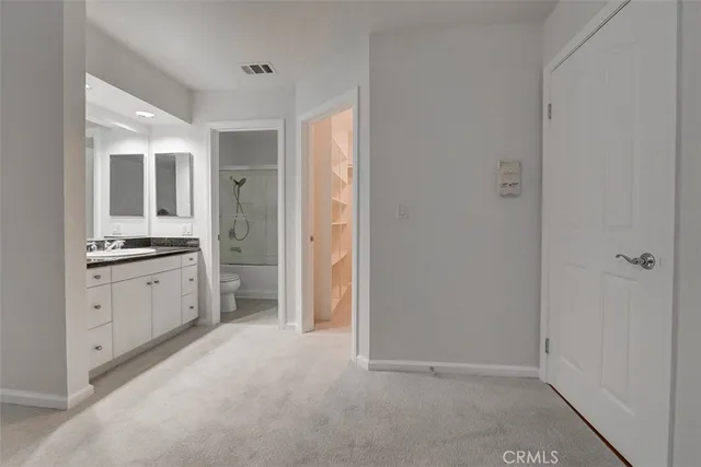 a view of cabinets with white walls