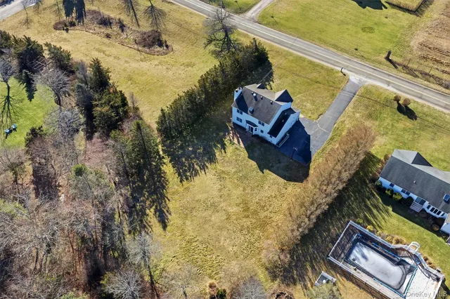 a view of swimming pool with a yard and ocean view