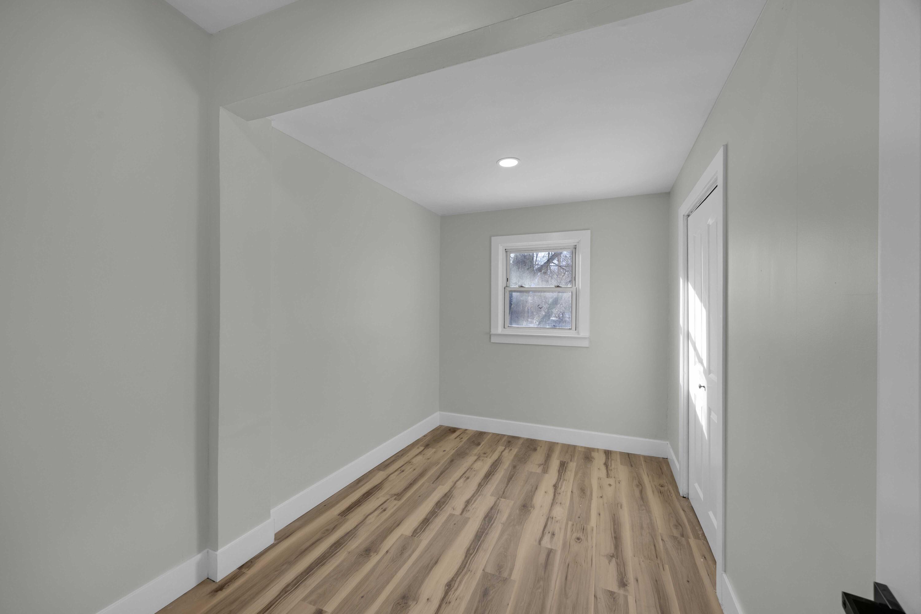 4200 Monroe Street Gary, IN 46408 - Photo 16 of 25 a view of a hallway with wooden floor