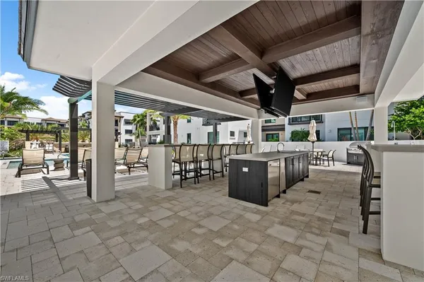 a view of a patio with table and chairs