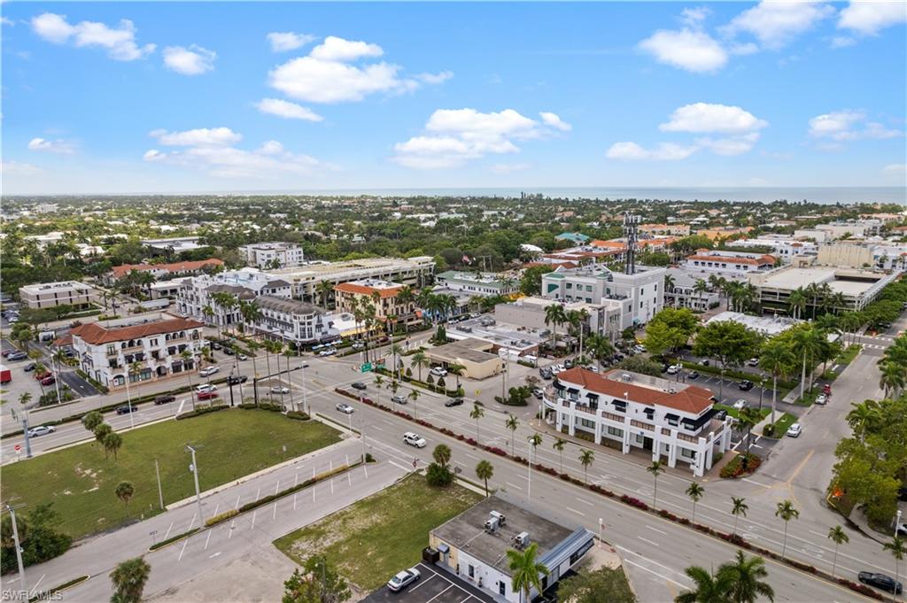 1130 3rd Avenue South, Unit 309 Naples, FL 34102 - Photo 26 of 29 an aerial view of residential houses with outdoor space