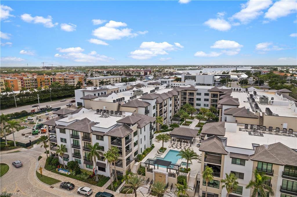 1130 3rd Avenue South, Unit 309 Naples, FL 34102 - Photo 27 of 29 an aerial view of residential building with parking space
