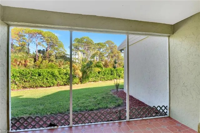 a view of a back yard from a room