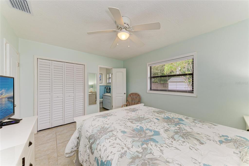 4424 87th St Court West Bradenton, FL 34210 - Photo 11 of 40 a bedroom with a bed and a window